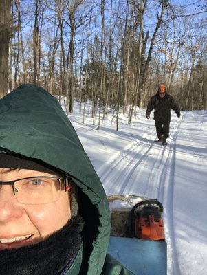 How come I'm walking and she's on the sled?