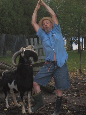 Real Men do goat yoga. They are one with the universe, or at least the barnyard.